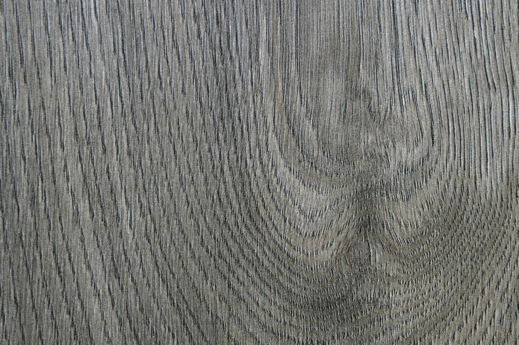 Close-up view of a natural wooden surface showing intricate grain patterns.
